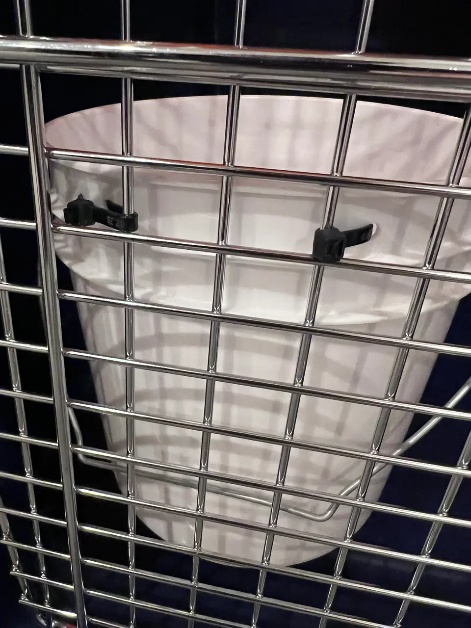 gallon bucket attached to travel crate
