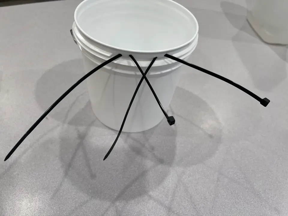 gallon bucket with zipties attached